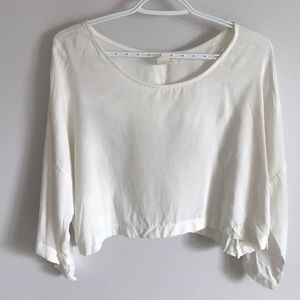 White blouse with button up on back detail